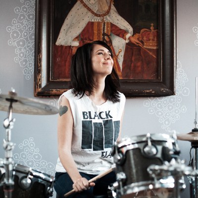 #3   Kathleen Hanna playing the drums. Photo courtesy of Allison Michael Orenstein